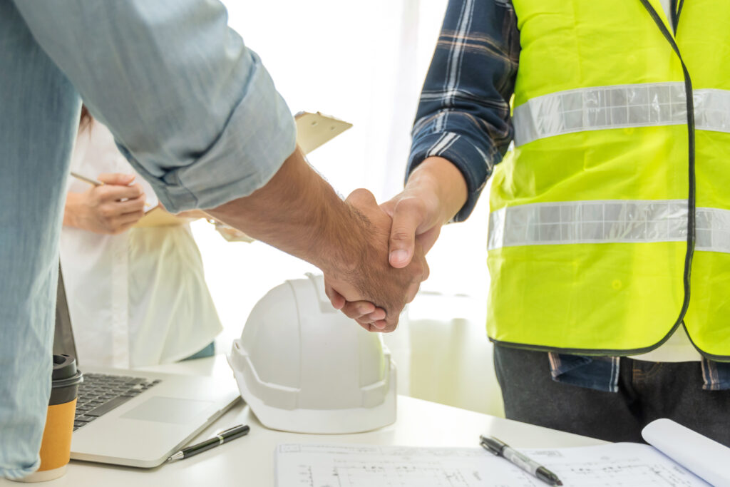 contractor handshake with customer after business meeting start